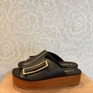 Anthropologie Black and Gold Sandals